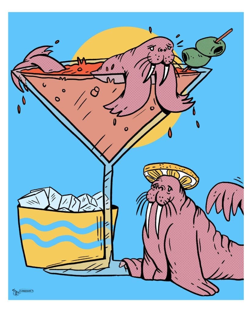 deux morses baignant dans un grand verre à cocktail avec des rondelles de citron en guise de couvre chef.